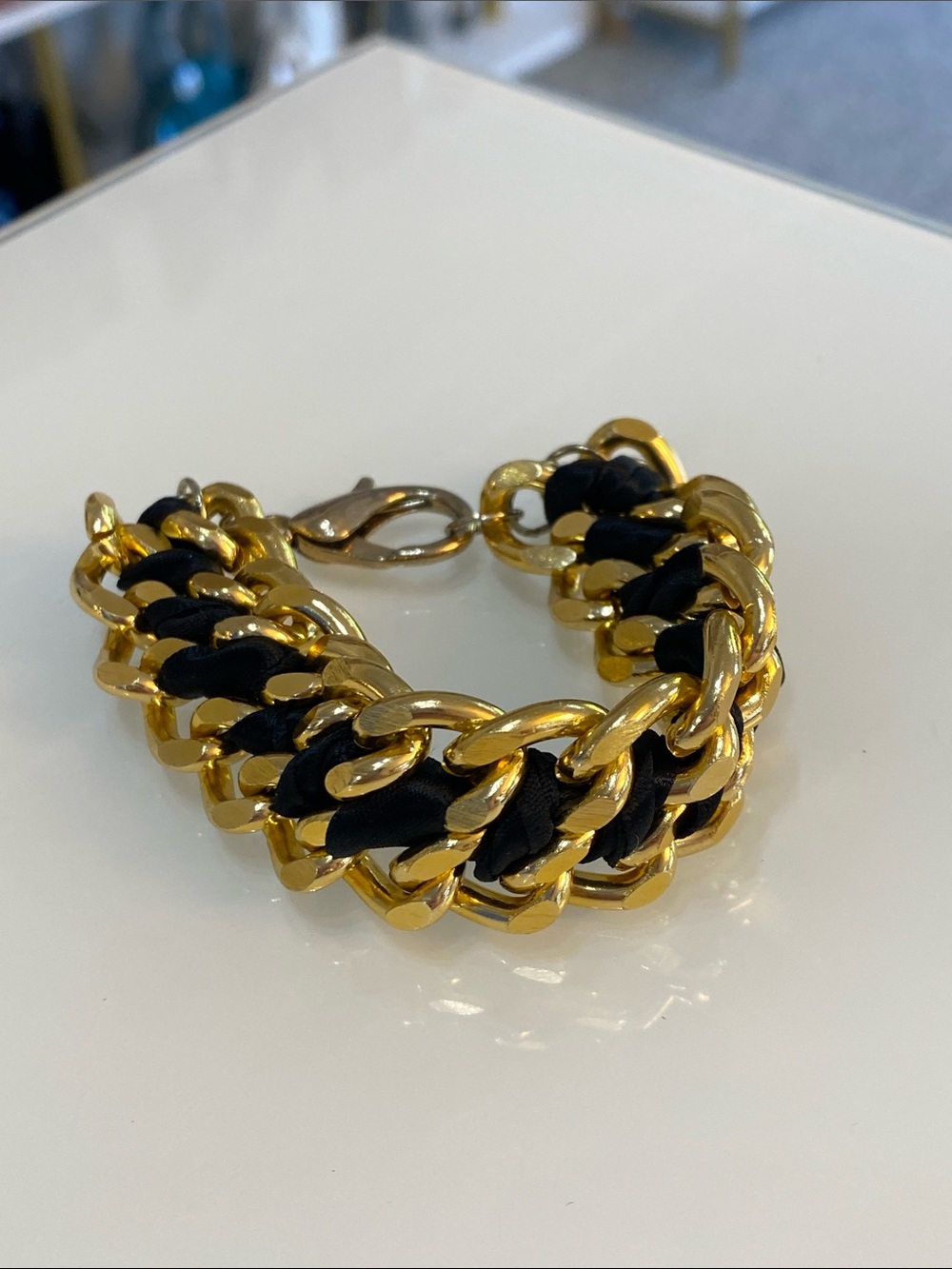Gold Tone Chain Bracelet with Black Weave